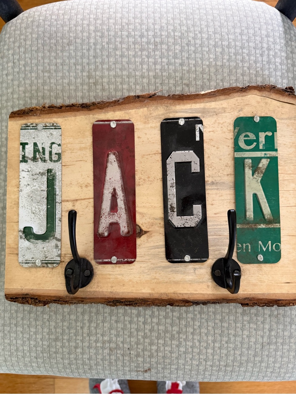 Personalized Rustic Wooden Wall Hooks with name made out of license plates.